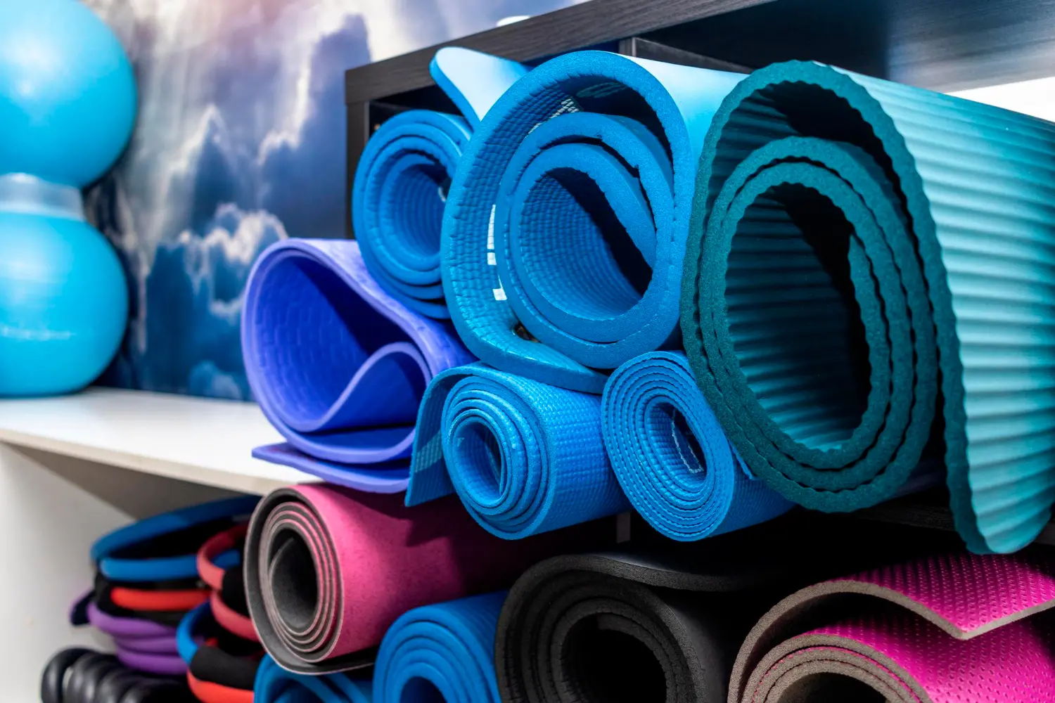 Photo sports equipment yoga mats of different colors and sizes