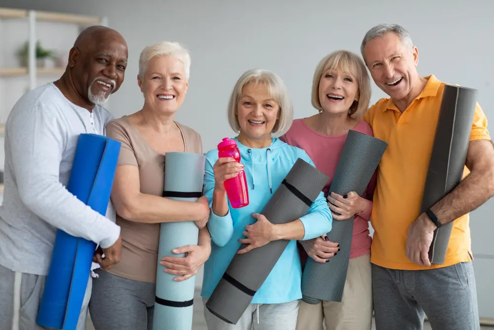 group-athletic-pensioneers-attending-yoga-class-retreat-center