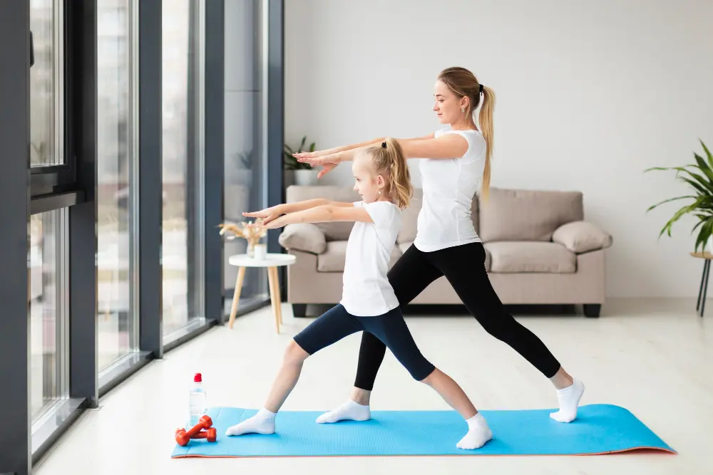 side-view-mother-exercising-along-with-child-home.jpg