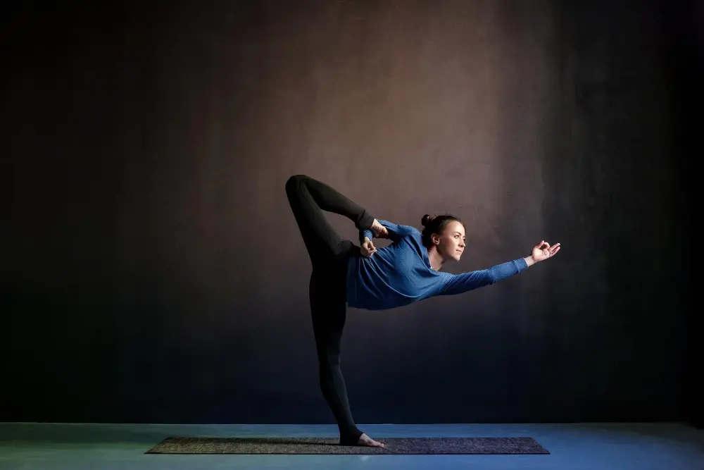 woman-practicing-yoga-stretching-natarajasana-exercise.