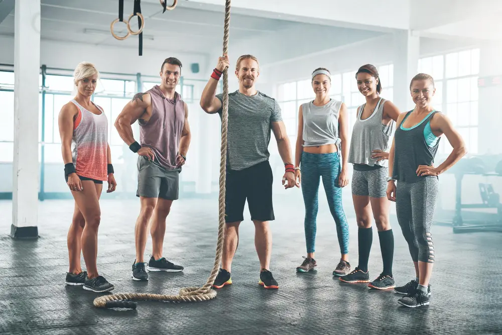 we-never-skip-mondays-portrait-fitness-group-standing-together.jpg