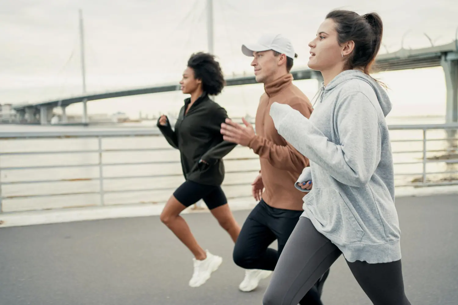 man-two-women-are-running-cardio-training-athletic-people-sportswear-fitness-workout.