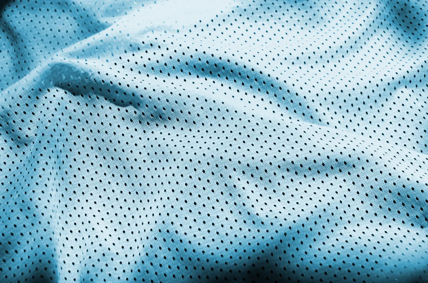 blue-sport-clothing-fabric-texture-background-top-view-light-blue-cloth-textile-surface-bright-basketball-shirt-text-space.